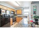 Galley kitchen with granite countertops and stainless steel appliances at 2924 Antique Oaks Cir # 46, Winter Park, FL 32792