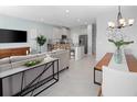 Open living space with kitchen, dining area, and modern furniture at 9851 Walkway Dr, Orlando, FL 32832