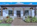 Inviting entryway with double doors and stonework at 2647 Zuni Rd, St Cloud, FL 34771