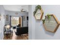 Bright and welcoming entryway with wood-look floors and Gathering decor at 3715 Calabria Ave # 0, Davenport, FL 33897