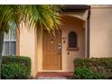 Well-maintained townhome entry with keypad and decorative window at 3715 Calabria Ave # 0, Davenport, FL 33897