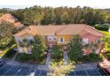 Aerial view of townhome community with lake at 4706 Vero Beach Pl, Kissimmee, FL 34746