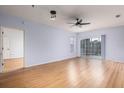 Spacious living room with light walls and laminate floors at 4881 Cypress Woods Dr # 3309, Orlando, FL 32811