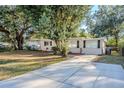 Ranch home with a long driveway and spacious yard at 5216 Montague Pl, Orlando, FL 32808