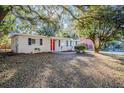 Charming ranch home showcasing a well-maintained yard at 5216 Montague Pl, Orlando, FL 32808