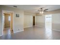Bright living room featuring tile floors and ceiling fan at 5216 Montague Pl, Orlando, FL 32808
