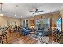 Open living room featuring hardwood floors and comfortable seating at 8426 Chamberlain Pl, Oviedo, FL 32765