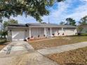 Newly renovated single-story home with a spacious front yard at 2113 Winnetka Ct, Orlando, FL 32818