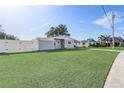 Charming gray house with white fence and yard at 1108 Evangeline Ave, Orlando, FL 32809