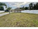 Large backyard with a spacious grassy area at 1208 Honey Rd, Apopka, FL 32712