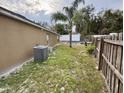 Backyard with a small pool and wooden fence at 1208 Honey Rd, Apopka, FL 32712