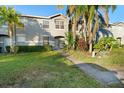 Two-story townhome, front entrance and landscaping at 13312 Summerton Dr, Orlando, FL 32824