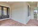 Inviting front entry with a modern door and brick walkway at 13607 Zori Ln, Windermere, FL 34786