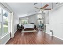 Spacious living room with hardwood floors and ceiling fan at 142 Santana Pl, Davenport, FL 33897