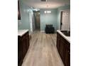 Light and airy dining area with a small table and chairs, and hardwood floors at 1526 Providence Rd, Lakeland, FL 33805