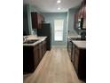 Modern kitchen featuring dark brown cabinets and light-colored countertops at 1526 Providence Rd, Lakeland, FL 33805