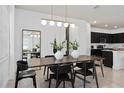 Elegant dining area with a large wooden table and contemporary chairs at 1833 Groveline Rd, Saint Cloud, FL 34771