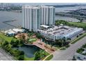 Aerial view of the condo complex, parking, and waterfront at 241 Riverside Drive # 409, Daytona Beach, FL 32117