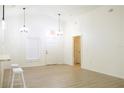Bright and airy living room with light wood floors at 308 Robin Rd, Davenport, FL 33896