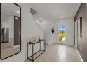 Bright and airy entryway with tile floors and a full-length mirror at 3332 Private Oak Dr, Apopka, FL 32703