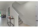 Modern staircase with carpeted steps and neutral wall colors at 3332 Private Oak Dr, Apopka, FL 32703