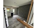 Open kitchen with gray cabinets and wood-look floors at 3548 Valley Trl, Lakeland, FL 33810