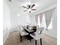 Dining room featuring modern decor, stylish furniture, and a decorative brick accent wall at 6163 Forest Ridge Way, Winter Haven, FL 33881