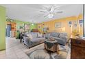Living room with gray sofas, coffee table, and decorative accents at 7403 Glen Oaks Way # 82, Winter Park, FL 32792