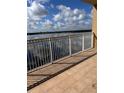 Balcony overlooking lake with tile flooring at 8749 The Esplanade # 29, Orlando, FL 32836