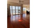 Living room with hardwood floors and water views at 8749 The Esplanade # 29, Orlando, FL 32836