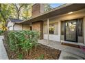 Inviting front entrance with a covered porch, and well-maintained landscaping at 1404 N Cove Blvd, Longwood, FL 32750