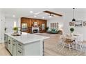 Modern kitchen with white cabinets, a large island, and stainless steel appliances at 1404 N Cove Blvd, Longwood, FL 32750