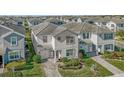 Two story house in a community with similar homes at 1564 Flange Dr, Davenport, FL 33896