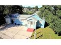 Nice blue house with a yard, driveway and garage at 1632 Gar St, St Cloud, FL 34771