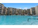 Inviting swimming pool area with lounge chairs at 2401 S Atlantic Ave # C306, New Smyrna Beach, FL 32169