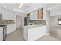 Modern kitchen with white cabinets, stainless steel appliances and an island at 2660 Bent Hickory Cir, Longwood, FL 32779