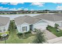 One-story home on lakefront lot with paver driveway and solar panels at 2789 Ruby Rose Ln, St Cloud, FL 34771