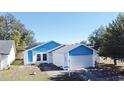 House with blue accents and solar panels, on a residential street at 429 Copperstone Cir, Casselberry, FL 32707