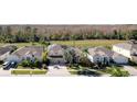 House with solar panels, pool, and lush landscaping in a community setting at 437 Prestwick Dr, Davenport, FL 33897