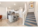 Modern kitchen with stainless steel appliances and granite countertops at 5649 Brosnan Rd, St Cloud, FL 34771