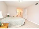 Bright bedroom with a double bed and en-suite bathroom at 669 Grenadine Ct # S, Winter Park, FL 32792