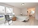Bedroom with a bed, chair, and view of the street at 669 Grenadine Ct # S, Winter Park, FL 32792