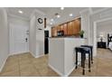 Modern kitchen with granite countertops and wood cabinets at 914 Charo Pkwy # 113, Davenport, FL 33897