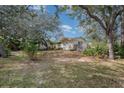 House exterior showcasing a covered entryway and lush foliage at 1 Black Jack Cir, Port Orange, FL 32128