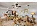 Spacious living room with hardwood floors and wicker furniture at 110 Dianne Dr, Ormond Beach, FL 32176