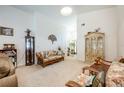 Living room with floral couches and a wooden cabinet at 12002 Great Commission Way, Orlando, FL 32832