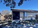 House exterior with a brown roof and solar panels, showing a gated entry at 1332 Azalea Way, Winter Garden, FL 34787