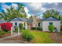 Charming bungalow with a manicured lawn and walkway at 1516 17Th Nw St, Winter Haven, FL 33881