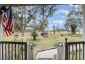 Relaxing backyard view with grill and open space at 23627 Franklin Ave, Sorrento, FL 32776