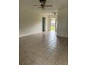 Spacious living room with tile flooring and ceiling fan at 2575 Edmond Cir, Auburndale, FL 33823